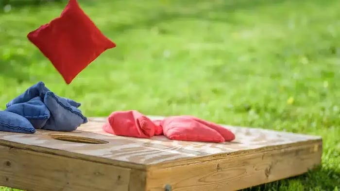 cornhole boards and other tailgating games can be stored in a storage unit