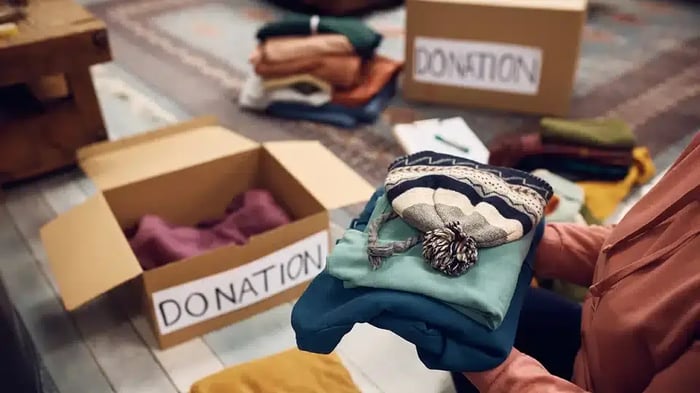 packing clothing to donate or store in a storage unit