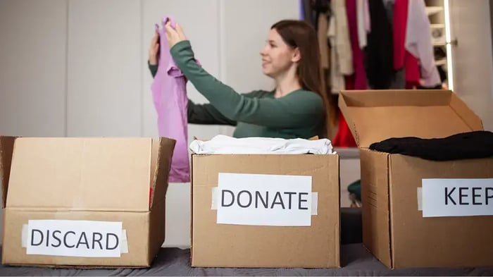 A woman sorting through clothes
