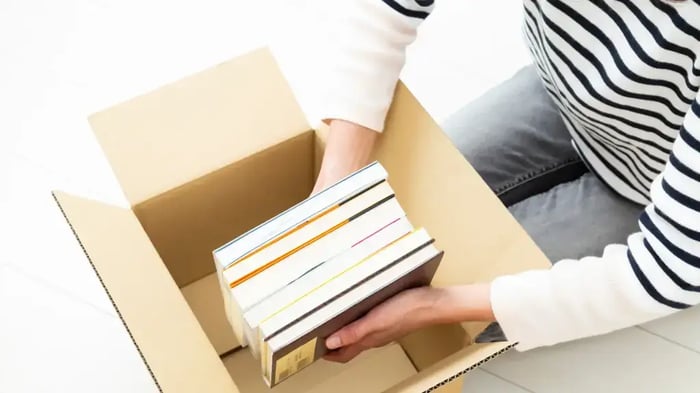 books being stored in a  moving box