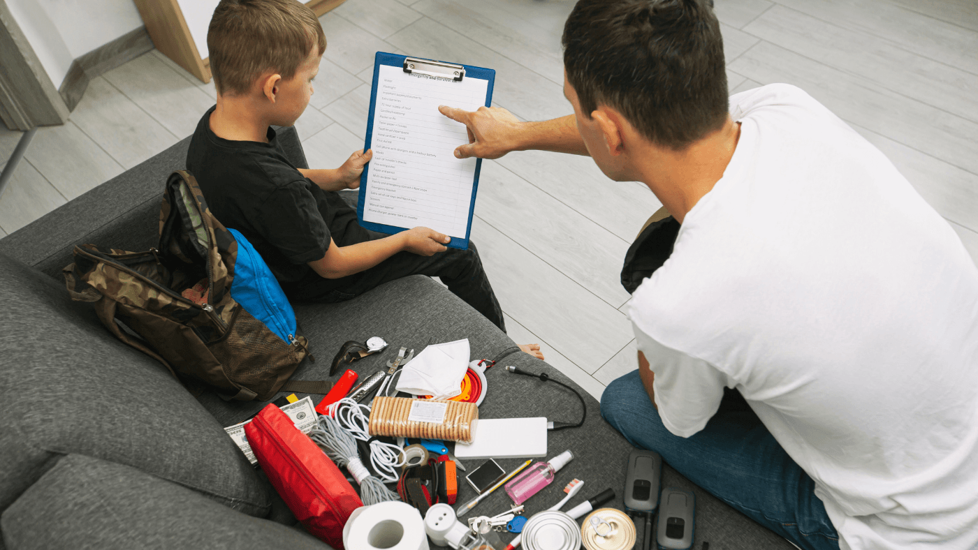 Family reviewing emergency supplies and planning what to do during an earthquake