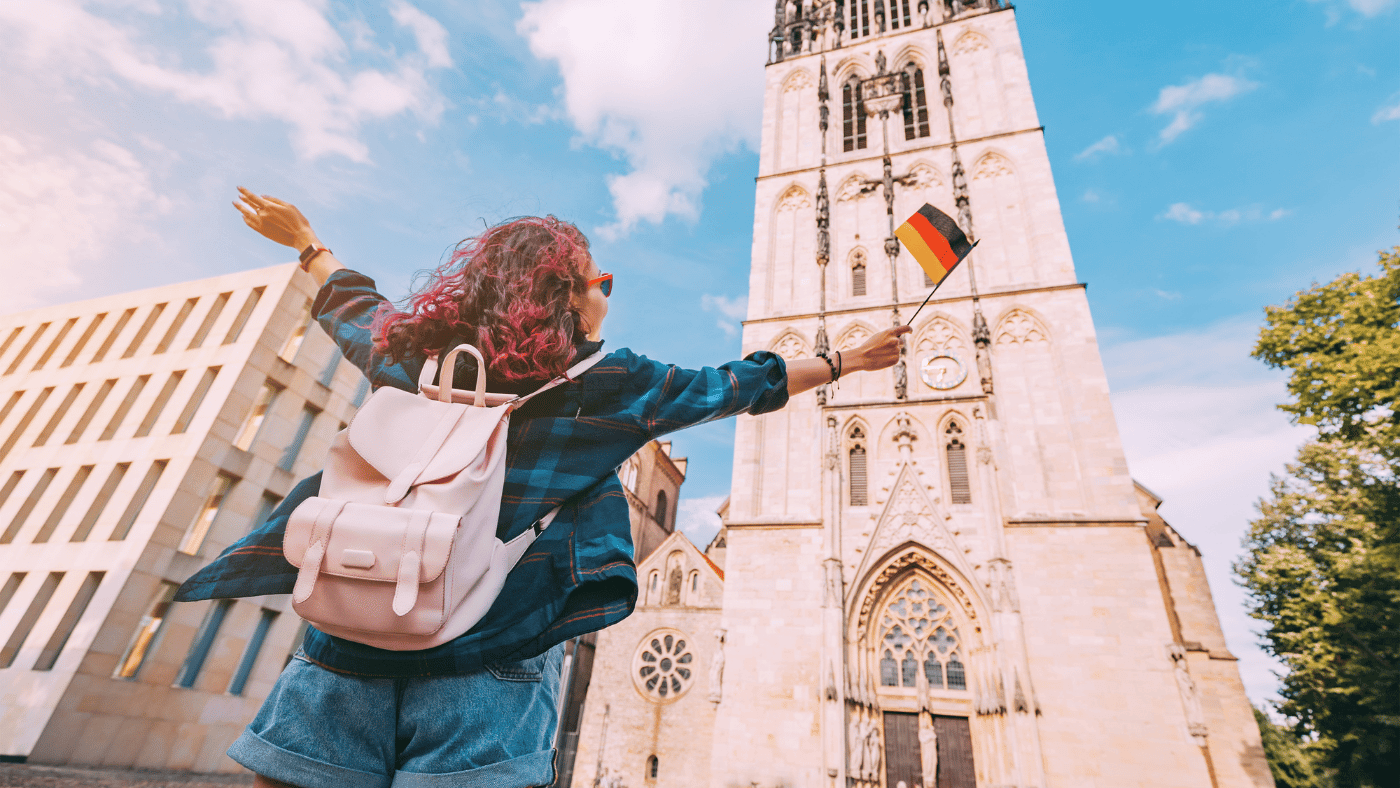 College student traveling abroad with a backpack near a university campus