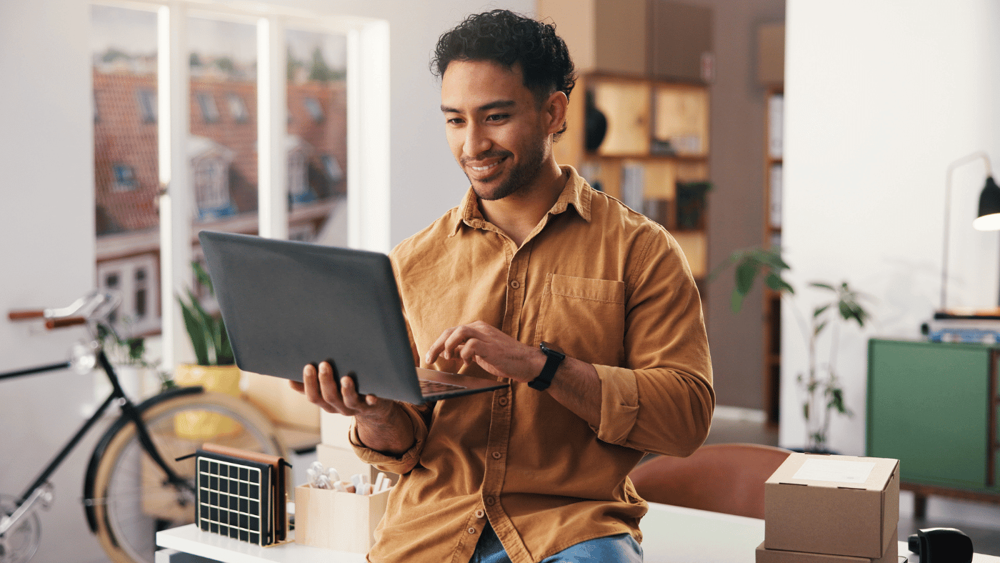 Man reviewing storage unit pricing and expenses at a desk