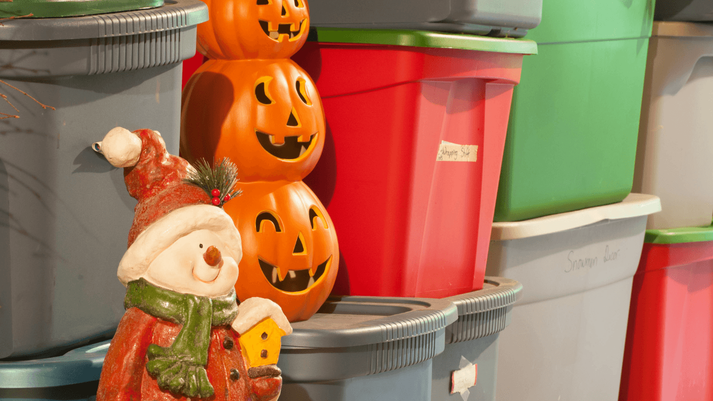 Holiday decorations and seasonal items arranged in colorful storage bins