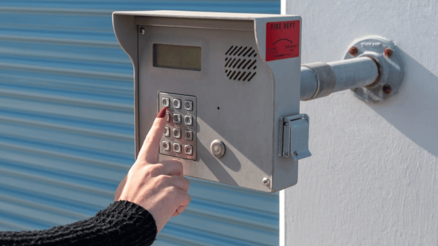 Storage property access keypad and lock attached to a storage unit door